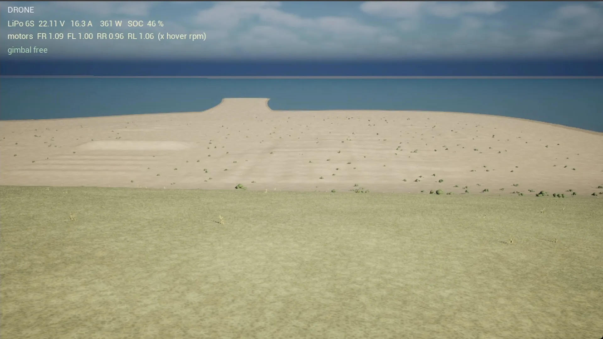 The drone in low flight over the sand, on its way to the start point